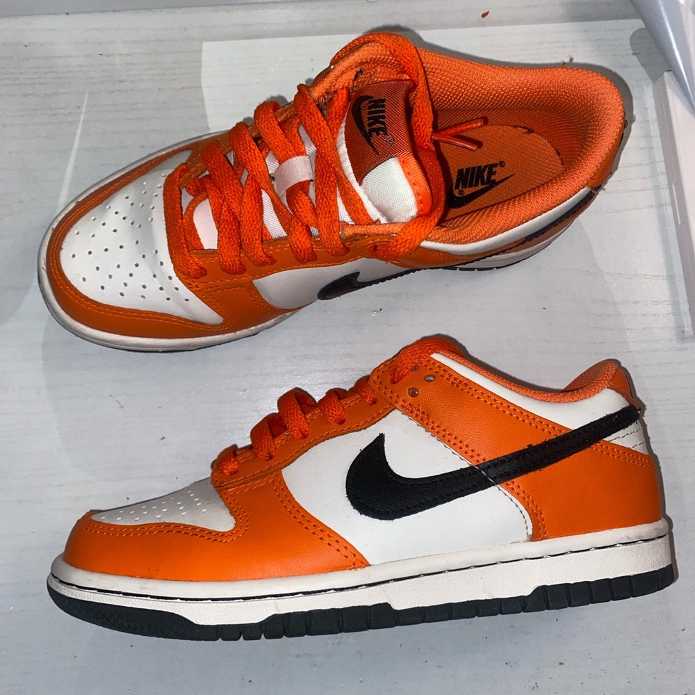 Orange black and white low dunks